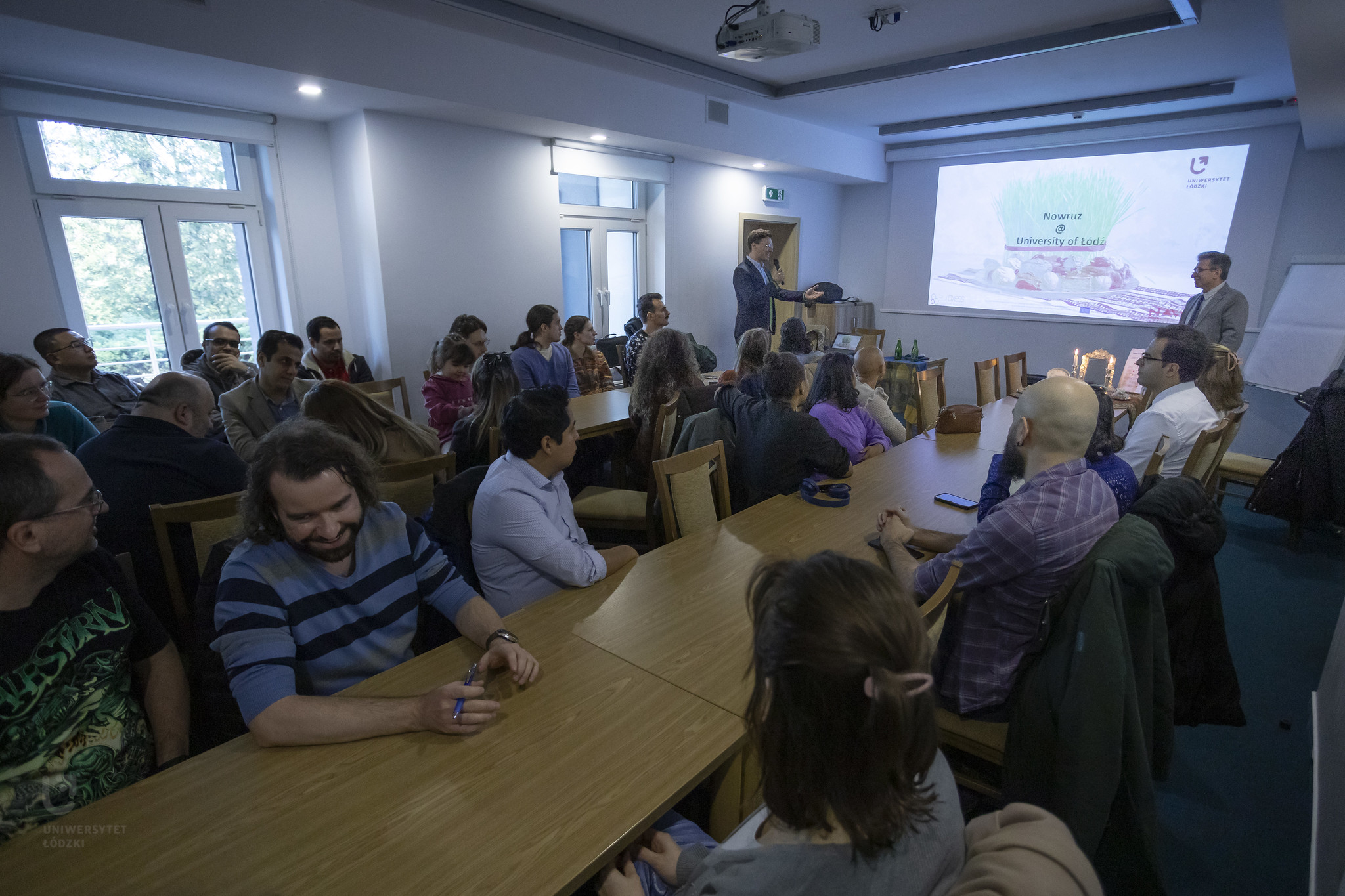 A group of people in a lecture hall.