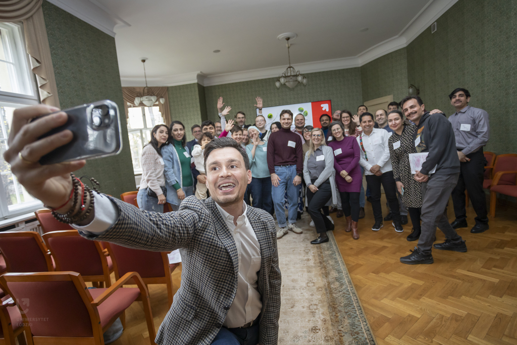 A group of people taking a selfie. 