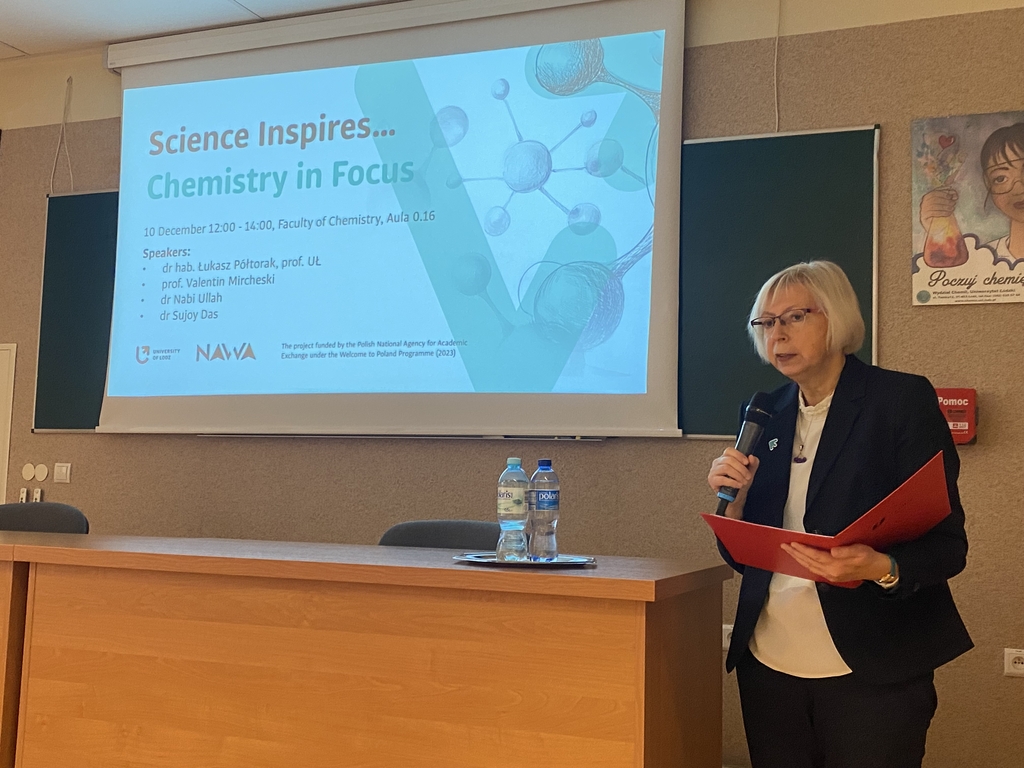 A woman giving a presentation.