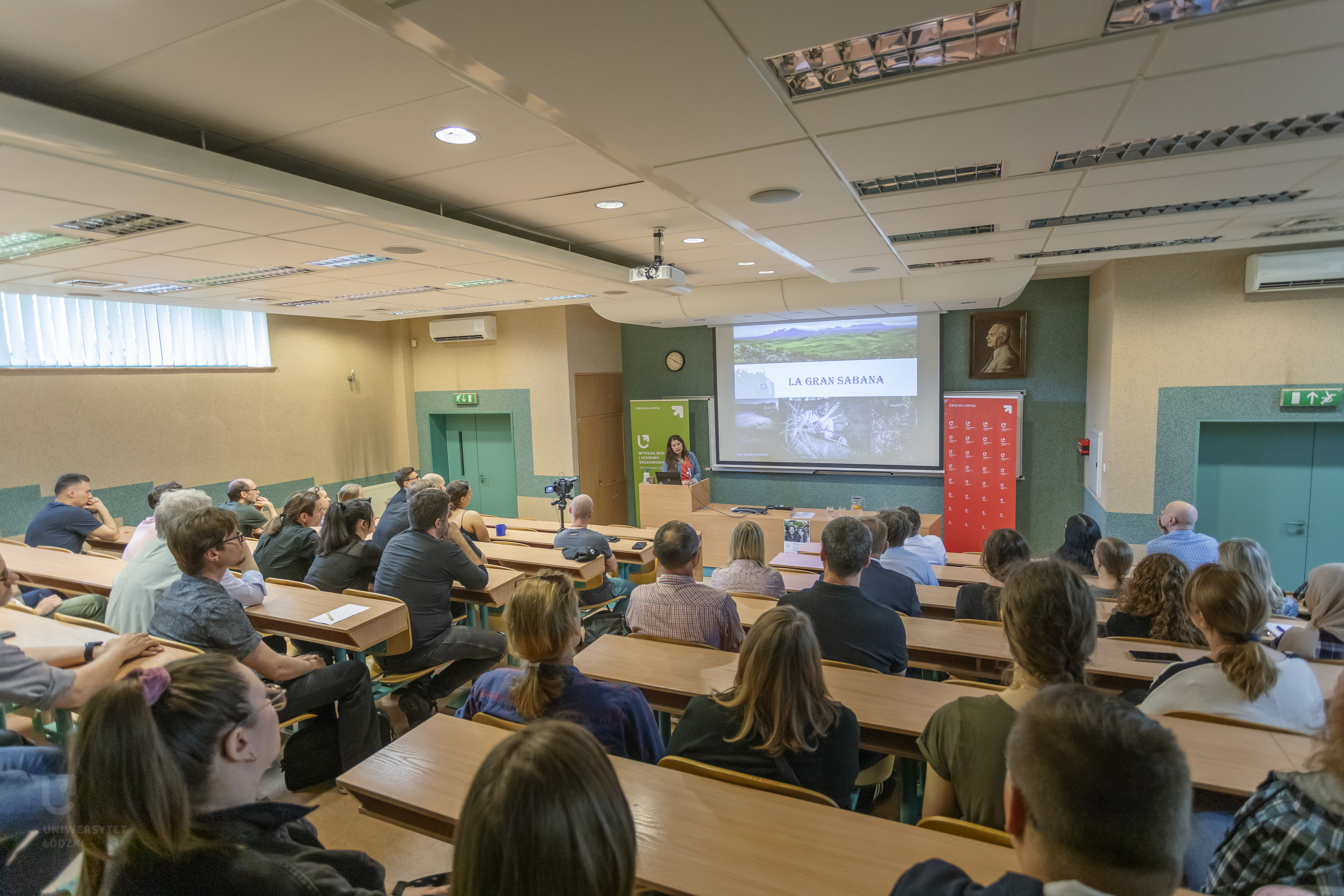 A lecture hall full of people.