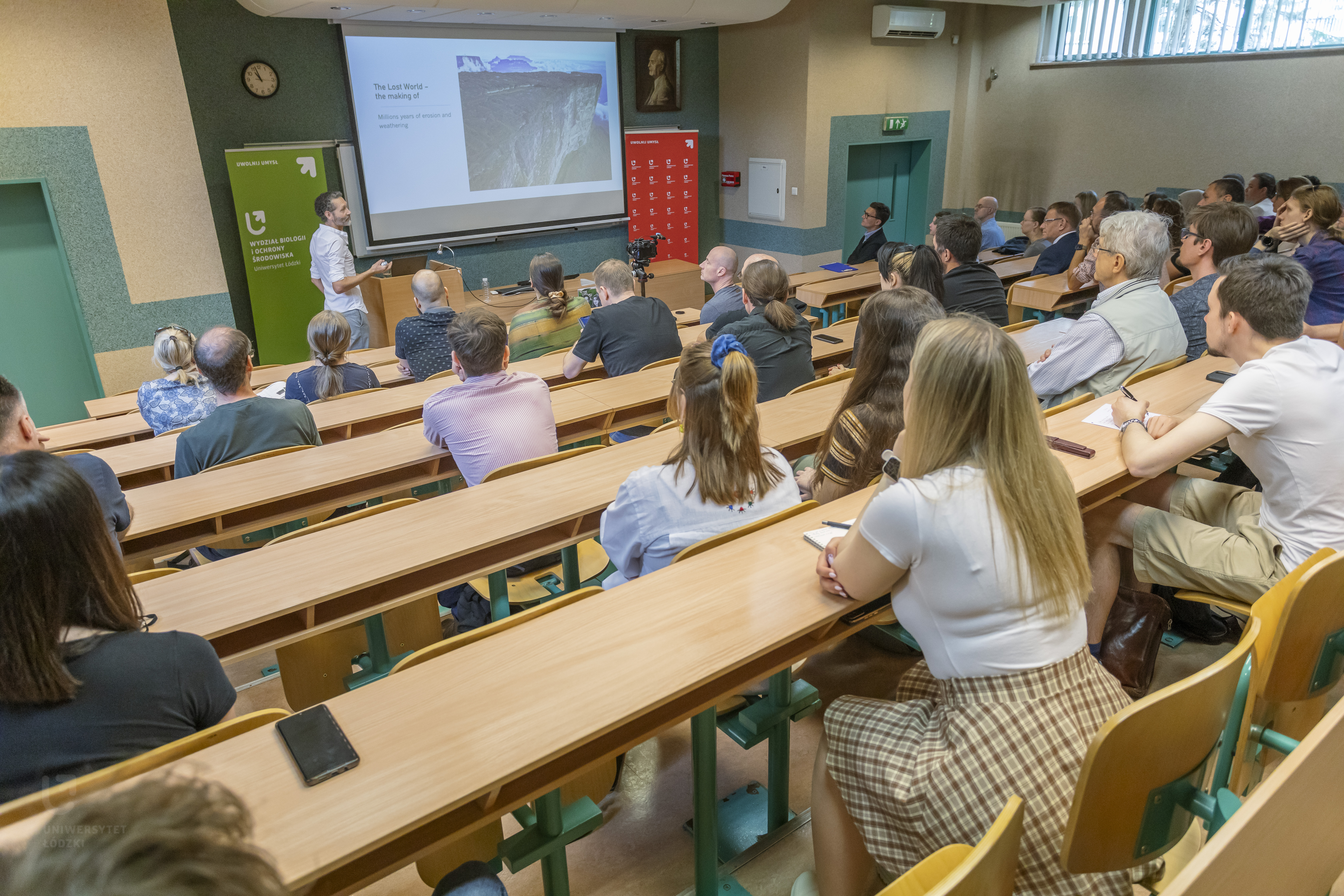 A lecture hall full of people.