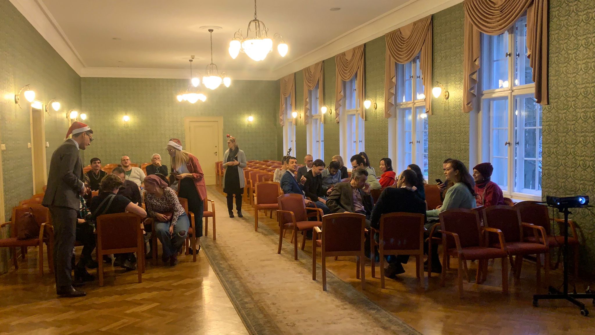 People sitting in a conference room.