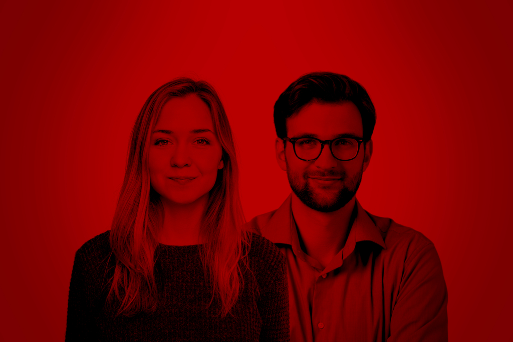 A man and a woman on a red background