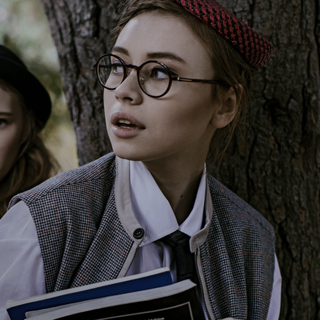 a colourful photo of a student wearing glasses